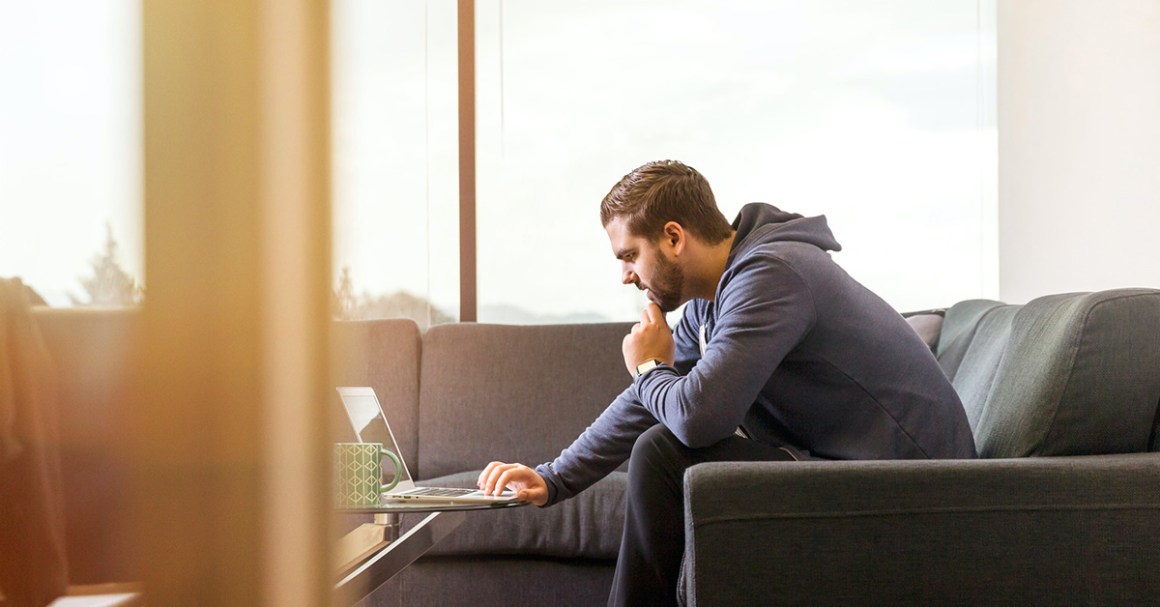 man on laptop thinking