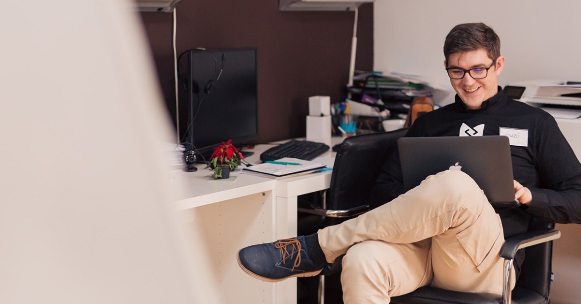 person on laptop smiling